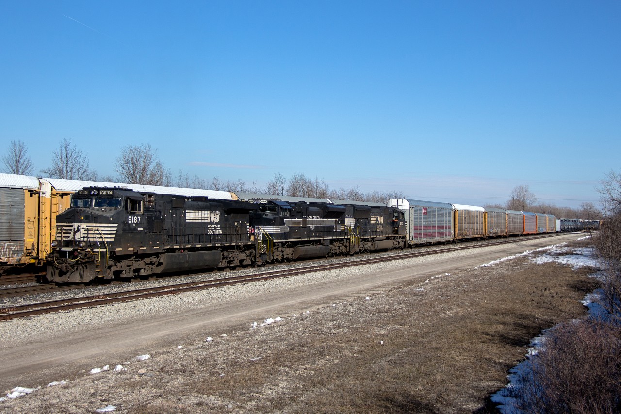 The 50th anniversary of New York Central's demise has brought about some amazing photos from fellow contributors, so I might as well upload this before the year's end.

Coincidentally enough, Norfolk Southern's NYC heritage unit managed to end up on the Buffalo-Fort Erie transfer in time for the big 50, sandwiched between NS 9187 and chiselled nose SD70M 2593. This is believed to be NS 1066's first visit, so it was good timing. NYC's presence on this section of the Canada Southern was not well documented, however Fort Erie was a significant hub for them. Track 99, which was the former CASO Fort Erie yard bypass track, is behind the autoracks, now owned by CN. Only about a quarter mile west of here is where the Chippawa Branch split off to Niagara Falls. The part of the CASO ROW that extends towards Welland was torn up a few years ago as far as Stevensville. The rest remains in CP's hands, now known as the Stevensville Spur.

The NS transfer typically ends up with around three to four heritage units a year. NS 1066 (NYC heritage) appears to be the first to visit that had any major significance to past railroad history in the area. The Wabash unit almost showed up once, but the air compressor failed before leaving Buffalo.

Being a bright spot in what is becoming an increasing dilapidated and depressing part of Fort Erie, NS C93 and the NYC heritage unit completed their yard work within a couple hours and waited some length of time to get clearance back stateside. Past memories of this train involved a typically much shorter consist, and the train would get clearance back into Buffalo almost immediately after finishing work. It's not quite as simple as it used to be, but at least the train is longer. Somewhat frequently now, CN has to run an X422 just to handle how much traffic NS is bringing across. Looking back about 10 years down to the month, this is when the Great Recession really began to take its toll on Niagara's rail traffic. CP never recovered it, though CN seems to be at its strongest point in the area since then.