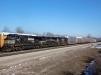 The 50th anniversary of New York Central's demise has brought about some amazing photos from fellow contributors, so I might as well upload this before the year's end.
<br><br>
Coincidentally enough, Norfolk Southern's NYC heritage unit managed to end up on the Buffalo-Fort Erie transfer in time for the big 50, sandwiched between NS 9187 and chiselled nose SD70M 2593. This is believed to be NS 1066's first visit, so it was good timing. NYC's presence on this section of the Canada Southern was not well documented, however Fort Erie was a significant hub for them. Track 99, which was the former CASO Fort Erie yard bypass track, is behind the autoracks, now owned by CN. Only about a quarter mile west of here is where the Chippawa Branch split off to Niagara Falls. The part of the CASO ROW that extends towards Welland was torn up a few years ago as far as Stevensville. The rest remains in CP's hands, now known as the Stevensville Spur.
<br><br>
The NS transfer typically ends up with around three to four heritage units a year. NS 1066 (NYC heritage) appears to be the first to visit that had any major significance to past railroad history in the area. The Wabash unit almost showed up once, but the air compressor failed before leaving Buffalo.
<br><br>
Being a bright spot in what is becoming an increasing dilapidated and depressing part of Fort Erie, NS C93 and the NYC heritage unit completed their yard work within a couple hours and waited some length of time to get clearance back stateside. Past memories of this train involved a typically much shorter consist, and the train would get clearance back into Buffalo almost immediately after finishing work. It's not quite as simple as it used to be, but at least the train is longer. Somewhat frequently now, CN has to run an X422 just to handle how much traffic NS is bringing across. Looking back about 10 years down to the month, this is when the Great Recession really began to take its toll on Niagara's rail traffic. CP never recovered it, though CN seems to be at its strongest point in the area since then.