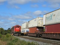 The engineer gives a northbound train of containers a roll-by.