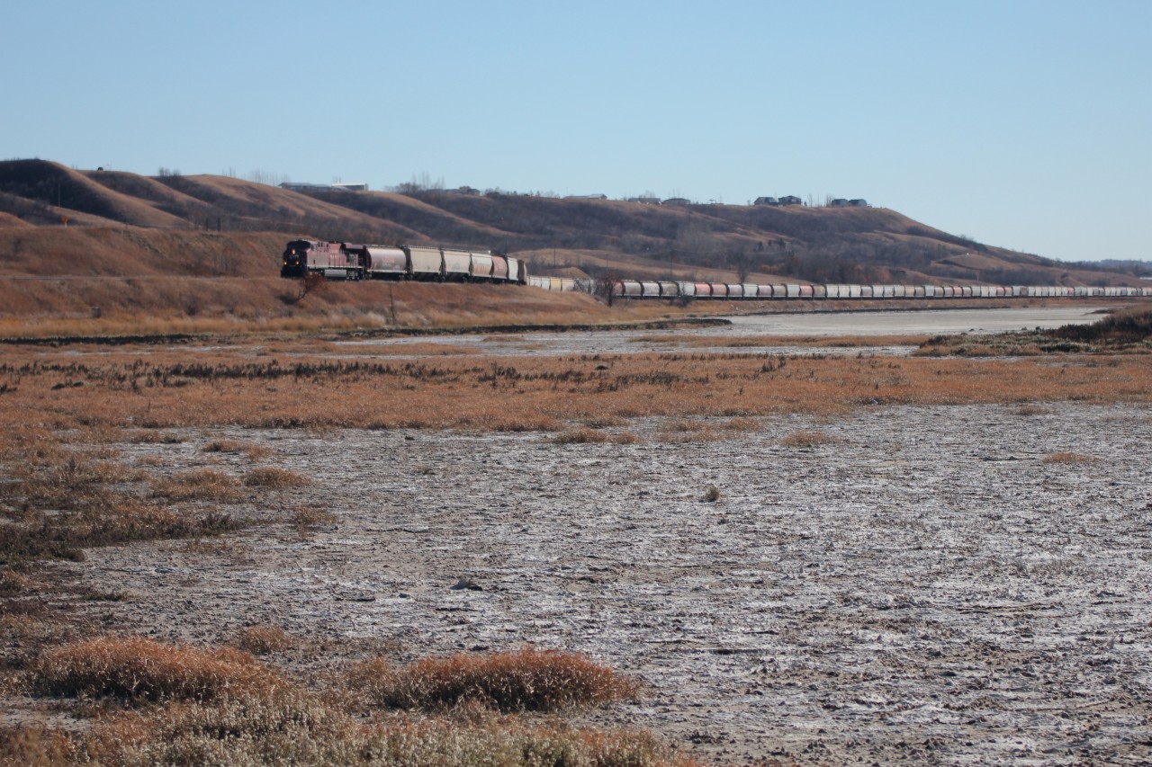 After briefly stopping in Craven to throw a switch, CP 8807 starts its climb out of the Qu'appelle River Valley with a string of empty grain cars in tow.