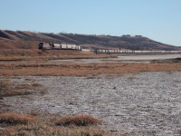 After briefly stopping in Craven to throw a switch, CP 8807 starts its climb out of the Qu'appelle River Valley with a string of empty grain cars in tow.