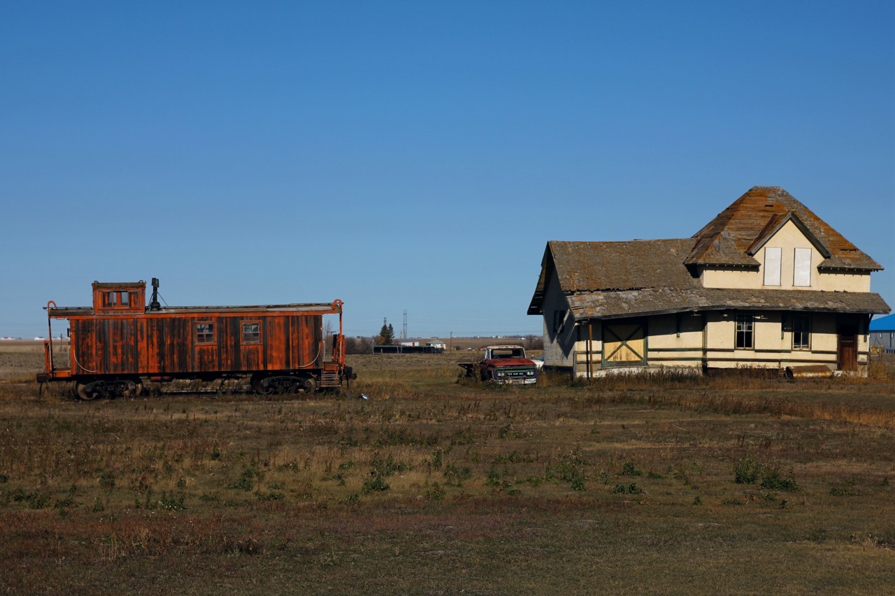You never know what you will find when you head out track side. I was driving into Pasqua to capture the days CP action when I found this scene. CN 79133 which has routes dating back to a boxcar built in 1918 sits next to the former CN station from Truax SK. The caboose and station are located off of Railway Ave in Pasqua which is where the CP Indian Head and CP Weyburn subs meet before heading into Moose Jaw.
