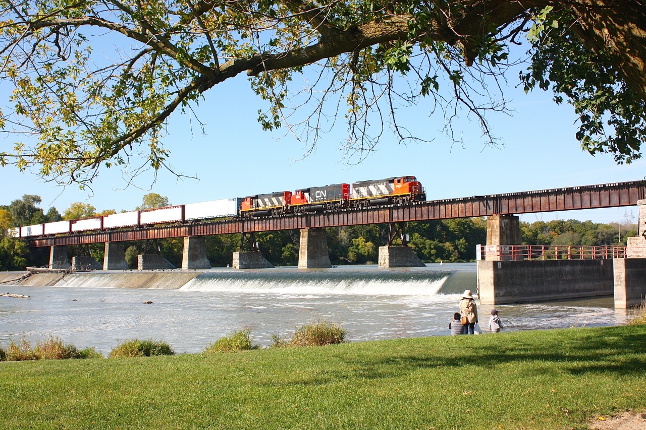 Canadian National had just taken back the Hagersville Sub. from the Southern Ontario Railway. Here is the Brantford area yard / road switcher running as train 580 crossing the Caledonia bridge over the Grand River, returning to Brantford with loads of gypsum board.