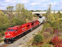 Former CP 9502 and former CP 9645, now all cleaned up and renumbered to CP 8001 and CP 8102, roll out from under highway 6 approaching the Newman Road overpass as they head down the Hamilton sub approaching Desjardins.