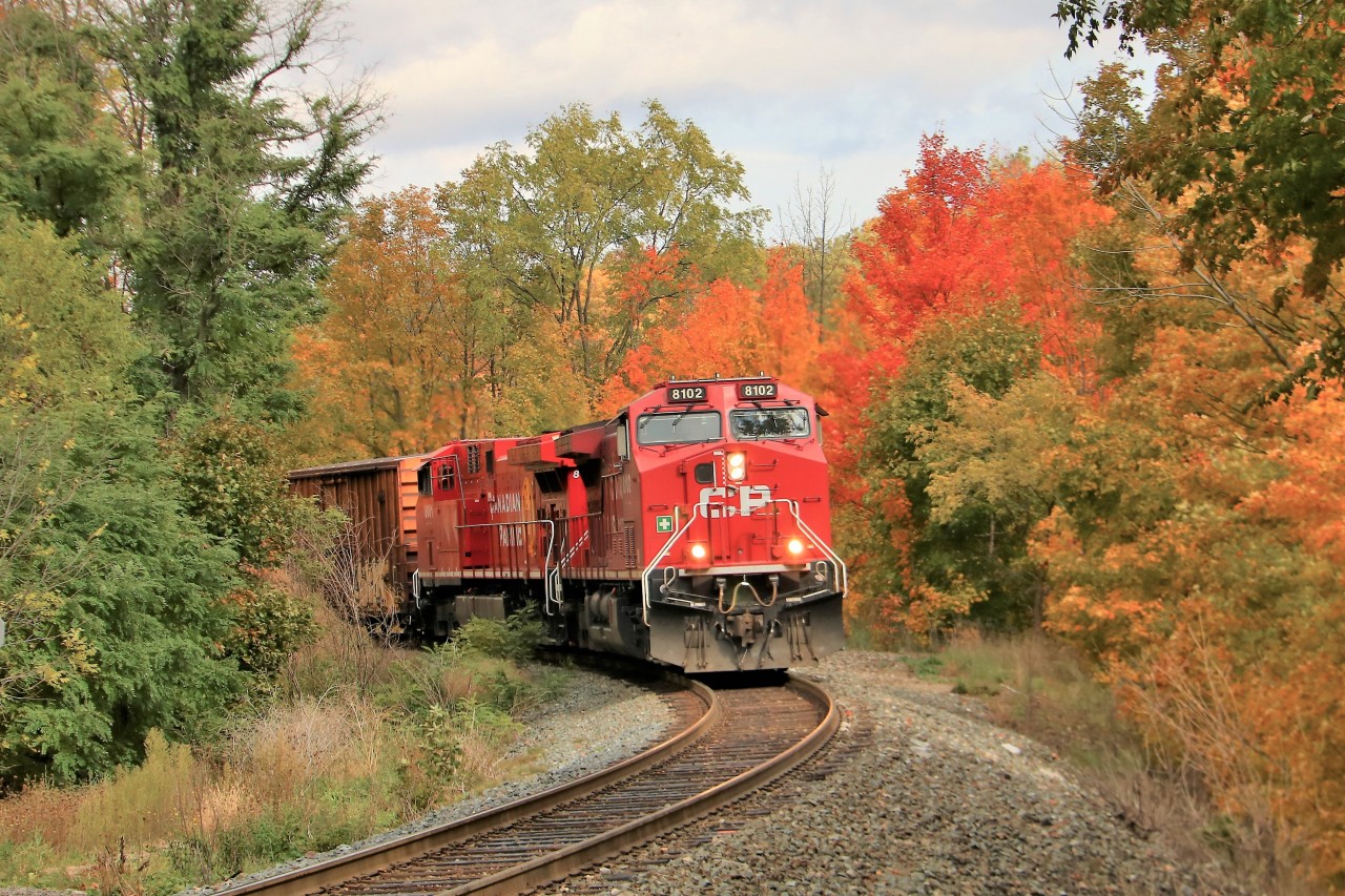 Todays CP 246 had the same power as yesterdays but in reverse. CP 8102 is leading CP 8001 through Waterdown approaching the new wooden bridge at Snake Road and Main Street on its way south to Hamilton.
