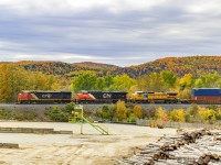 CN cowl 2454 leads train 306, as they pass the Irving Mill at Baker Brook, New Brunswick, nearing their next crew change point of Edmundston, New Brunswick. 