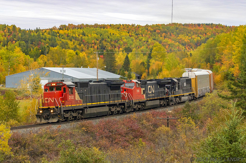 CN 2132 leads train 305, as the round the S-Curve at Lac Baker, New Brunswick. The leader, CN 2132, is missing it's side noodle, on the conductors side.