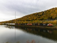CN 5693 leads westbound train 407, as they rumble along the scenic Folly Lake, Nova Scotia in Fall colors. 