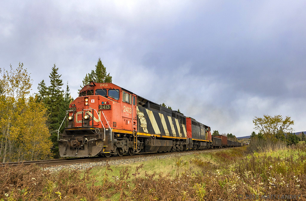 A pair of cowls lead train 406 at Passekeag, New Brunswick. Feels like the 90s all over again. I miss these great lashups.