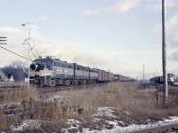 And the race is on! An NYC westbound led by FA2 1068 (with an FB2 and an FB1) has a slight advantage in horsepower (4700) versus the trio of F7As on the Wabash (4500), and through the Canfield interlocking (60 mph for NYC freights on the Canada Division versus 50 mph on the Cayuga sub); however, track speed for freights is 60 on both lines.

They had better sort it out before they get to the Yarmouth diamond 81 miles to the west (where the Cayuga sub crossed the CASO just east of St. Thomas)!