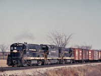 It is April 1968 and the NYC was still quite active on the CASO Sub.  U25B 2533, GP40 3042 and U25B 2521 are in New York Central paint seen here westbound at Clanbrassil.  