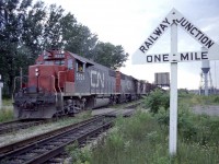 Admittedly not much of a shot but I decided to post this to show the old "Railway Junction" signs that used to dot the rail landscape many years ago. I'm shooting a 'Falls-bound' CN 5524, 5500 and ?? as it crosses Bridge 6 over the Welland Canal, and the sign on the right brings attention to westbound trains of the junction lying ahead, which is the line running to Port Weller as well as the small yard by the old Merritton Station. I don't know when these signs became redundant on the railroad, as I had forgotten they even existed until looking over some old photos.