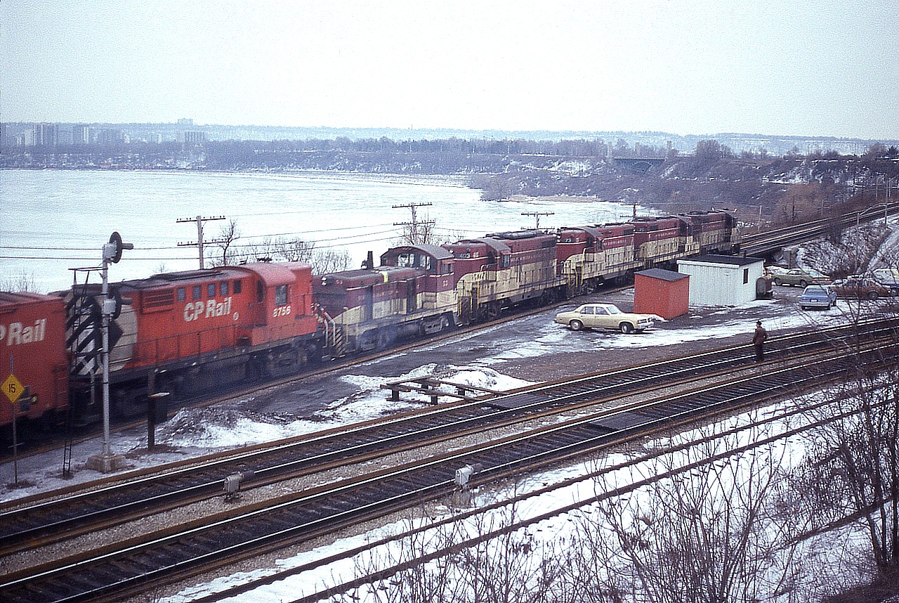 Yeah, so I decide to shoot the Starlite off the hillside at the Royal Botanical Gardens for a change as it was not too much trouble fitting in 3 or 4 units.  That is the time they have to send 6, and I cannot get a decent shot due to the angle and the brush, so grab this "going shot" with all the power and some of the fans and their cars in the scene. Such a gathering tells me it is a weekend.  Consist is TH&B 77, 76, 73, 403, 53 and CP 8756.  Another cruddy dull cold and miserable day, weatherwise.