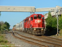 A photo I've been after for some time finally comes to fruition as a westbound CP train passes the very large, sprawling Lafarge plant at Zorra, Ontario while some searchlights hang on for dear life. I hope these survive into next year. I've been enamoured with Arnold's photos of the Zorra station <a href=http://www.railpictures.ca/?attachment_id=6142 target=blank>(photo 1) </a> | <a href=http://www.railpictures.ca/?attachment_id=29412 target=_blank>  (photo 2)</a> and the corresponding St. Marys sub for some time - the station long gone, St. Marys sub gone by '96 with a small stub, about a half mile of track left behind to service the plant. A neat area just a stones throw from the CN at Ingersoll, about a 8 minute drive.<br><br>