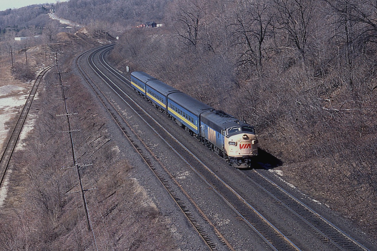 A few times, when I had the ambition, I parked at the old Dundas station (in the far background) and walked over to the Canada Crushed Stone conveyor overhang high above the CN mainline at mile 4 and watched for trains. It was unsafe and stupid, but I survived to tell of it. When VIA 6513 came along, I knew of the engine number from a long way off. That flesh coloured nose gave it away. I loved the view from up there. Another nice spot was on the left side where the curve begins; the bare hillside gave a great view of everything heading westbound, and quite a few images from that location I have posted. My overhead lookout was removed in 1993, bringing that era of photographic stupidity to a close.