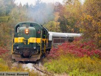 The colours at Cedar Curve on the York-Durham Heritage Railway are changing as a pair of ALCO/MLW units shatter the silence of a quiet Thanksgiving Sunday. With an extra-long consist to accommodate the extra passengers enjoying the fall colours, YDHR 22 and 3612 were both put into service pushing the train towards Stouffville. This operation was very resource-intensive, needing three running crews. The first crew is up in the cab car, the second in 3612 and the third in 22. This was old-school MUing, with radio instructions relayed between the two locomotives as the crews manually notched up and down in tandem. 
