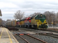 Another one from GEXR's "Rainbow Era" of power: GEXR #432 slowly rolls through Georgetown past the station as it comes off the Guelph Sub and proceeds east on the Halton Sub bound for CN's MacMillan Yard. Not one unit here matches, but that was typical of the mix of 4-motors that showed up: GEXR GP40 4046 (ex-Virginia Southern, originally built for the MKT), RLK GP40 4096 (a former CN 9300-series unit), LLPX 2236 (an ex-Long Island RR GP38-2 once used in commuter service) and GEXR GP40 4019 (originally built as a hi-nose N&W unit). No matching G&W orange in sight for a few more years!