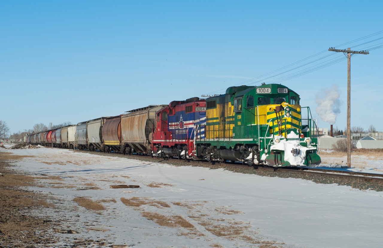 The Carlton Trail Railway is seen making its normal Monday afternoon appearance in Saskatoon with a cut of grain cars from Prince Albert SK. The pair of "Paducah-builts" (GP10's) are mighty fine looking units in my opinion.