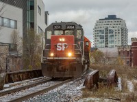 A hint of Southern Pacific in the Royal City. With less than a week until the CN takeover, GEXR train no. 431 rumbles through downtown Guelph with an ex-Cotton Belt tunnel motor doing the honours. The recently applied 'after market' nose decal was a welcomed addition!