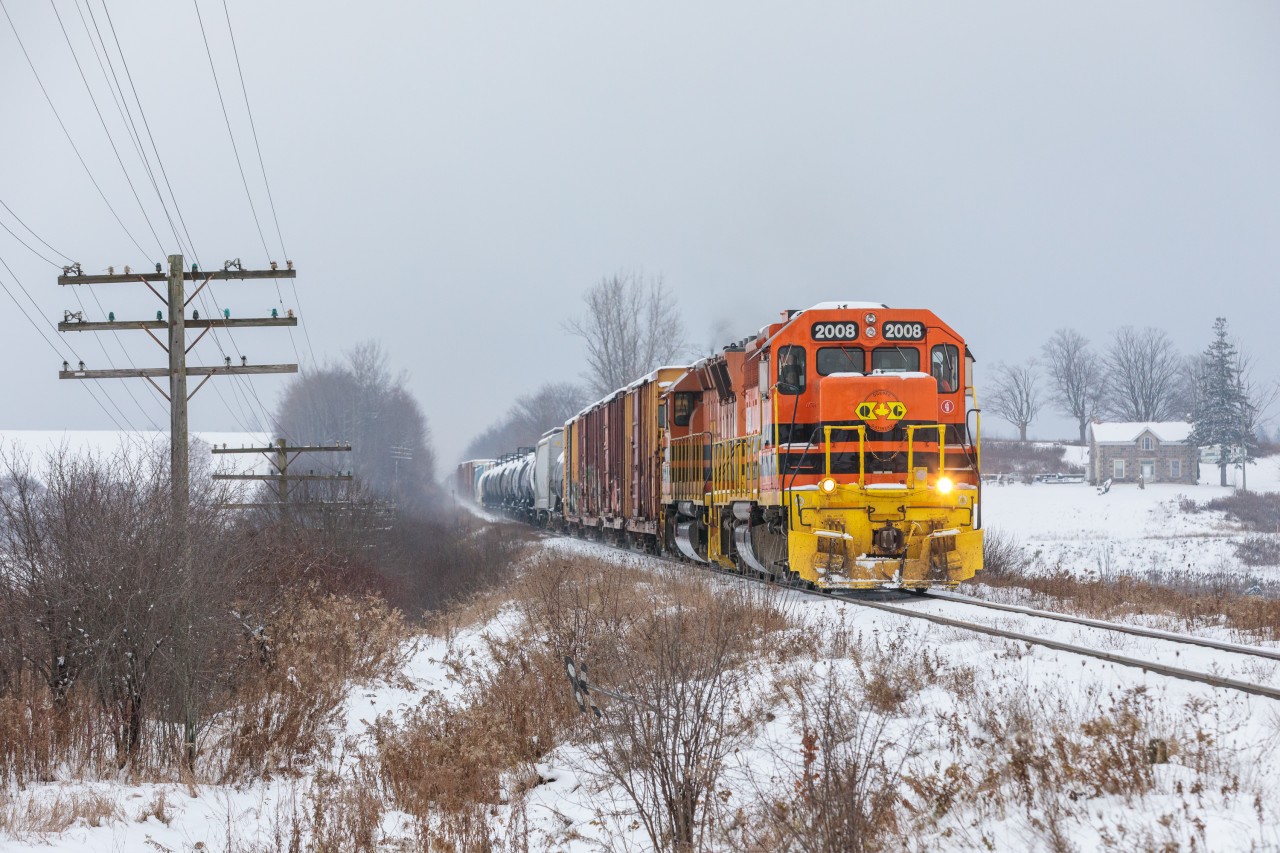 On the afternoon following the region's first major snowstorm, and CN's takeover of the GEXR, Quebec & Gatineau 2008 lugs CN train no. 432 through the countryside at Mosborough, ON. A shot of redemption for those trackside after GEXR's departure from Southern Ontario, which was swift and rather lacking of fanfare. Although these locomotives don't read "GEXR", their character is everything railfans came to love the railroad for. Nothing like old-school EMDs hauling heavy duty tonnage at speed. Perhaps things didn't end the way people had expected them to, but as far as I'm concerned, this send off was good enough for me.