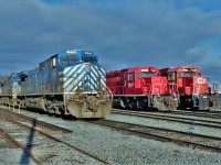 A trio of CEFX "bluebirds" await end of lease transfer while ex CP SD40-2 KXHR 5698 and CP 6618 wait for their fate.