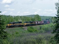 With the recent unveiling of Ontario Northland's Heritage SD40-2, I went looking for a vintage ONR shot to scan. While there are good memories of 3 day Holiday weekends with a much younger crew from Cleveland, the shots show that we had some real challenging weather.  For this one the high-sun hazy sky sort of cooperated but the weather wasn't the only challenge for this shot.  We were there early and decided to wait it out away from the car.  It was unseasonably warm and humid and the black flies were out in force.  You all know that if you let them bother you, it can drive you crazy, and I can remember wishing for any kind of breeze.  This is a southbound train almost home, just about where the railroad joins Trout Lake Rd for the rest of the way into North Bay.  Power is 2 of the SD40-2's in their as-delivered paint, like the #1730 that was unveiled recently. May 28, 1979.