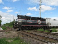 A sunny Spring afternoon finds CCGX 1000 thumping over the interlocking diamond in downtown Brampton, working OBRY's biweekly interchange run heading south to drop off 9 cars for CP at Streetsville Junction, where it will then lift 5 cars and <a href=http://www.railpictures.ca/?attachment_id=14047><b>head back north</b></a> to Orangeville Yard. The crew would then depart the yard and switch some of the industries at the <a href=http://www.railpictures.ca/?attachment_id=12489<b>north end of town</b></a> before calling it a day. <br><br> Built in 1957 for the Quebec, North Shore & Labrador and looking a little worse for wear, the aging 1000 was the sole power holding down the OBRY's operations since the line's takeover from CP in 2000. Next month, <a href=http://www.railpictures.ca/?attachment_id=5833><b>GP9RM 4009</b></a> (a rebuilt ex-CN unit that was formerly used on Cando's Athabasca Northern operation) would arrive to "take over" operations. Both units were used on the line (sometimes together) for the next little bit, but eventually 1000 was sent east to Cando's switching operation in Bath, and at last check had been forwarded to Cando's Winnipeg shop. OBRY went through a few different GP9 units in the years that followed (4009, 4015, then 4014) before Cando pulled out and Trillium took over operation of the line.