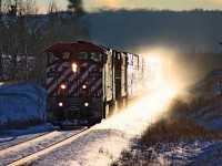 A photo from Dale Miller taken on a bright and cold winter afternoon. Dale had been for a visit with me in Williams Lake during a highway trip north and chased our train along the way. Anytime Dale was out and about chasing trains, BCOL 4601 always seemed to be in the area. Seen here at mile 357 on the BC Rail Prince George subdivision my three unit consist has just crested 4 miles of ascending grade including a nasty one point five percent one mile segment. We were really bogged down and eventually discovered that the second unit had returned to idle with some computer fault and no alarm indication on the lead unit. 