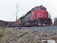 A north bound empty coal train on the BC Rail, Tumbler subdivision.  I think this was taken at the north end of Tumbler siding and I can't recall why we were stopped there, I did take the opportunity for a photo. We had lots of power, no doubt the pusher power further along was going to be swapped out with some of the units we had. I cannot find the location on the website map.