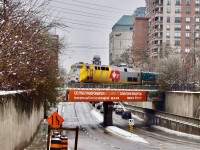 After picking up a handful of passengers moments ago at the station, VIA 84 is now leaving Downtown Brampton as it continues on towards Toronto. They are passing over the Queen st overpass and lead unit was a wrapped P42 as VIA continues to celebrate their 40th anniversary in year 2018. As years end approaches, word has it that VIA plans to get a new paint scheme once the wraps come off. It’ll be interesting to see what they come up with! <br> Time: 10:57