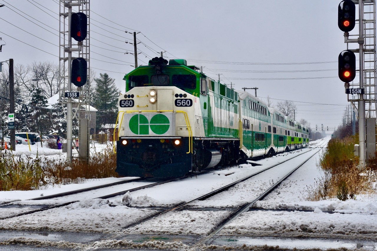 Winter Wonderland!  The 12:06 GO Train from Mount Pleasent to Union is seen arriving on time at the Downtown Brampton GO/VIA station with its usual 6 car train that runs on the Halton at this time of day. Lead unit was F59 560 and this morning we had our first significant snowfall of the year!