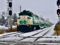 Winter Wonderland! <br> The 12:06 GO Train from Mount Pleasent to Union is seen arriving on time at the Downtown Brampton GO/VIA station with its usual 6 car train that runs on the Halton at this time of day. Lead unit was F59 560 and this morning we had our first significant snowfall of the year! 