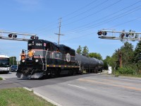 With a pair of crew members riding on the nose (one being former OBRY operatior Steve Bradley who has since been promoted to BCRY after Cando handed the Owen Sub operations over to Trillium) CCGX 1001 makes its way across Young st in Barrie with a pair of tank cars destined to Comet Chemicals Ltd at the end of the line in Innisful. 