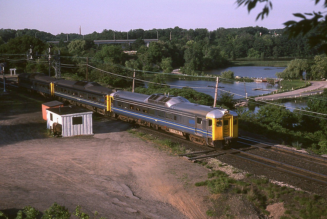 I'm not sure which train number this is, as I recall the Budds heading to Niagara just after 1800 out of Burlington West, and since this is almost 'the longest day' the sun looks farther down that I would imagine it to be at 1800.  But at least the sun was out. Nice evening light on the lead Budd as well as the wooden Bayview sign at the far left.  Strangely enough, no other fans around. Tranquility.