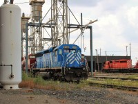 CEFX 3143 an SD45 body with the innards of an SD40-2 awaits fueling and sanding just east of the service tracks.