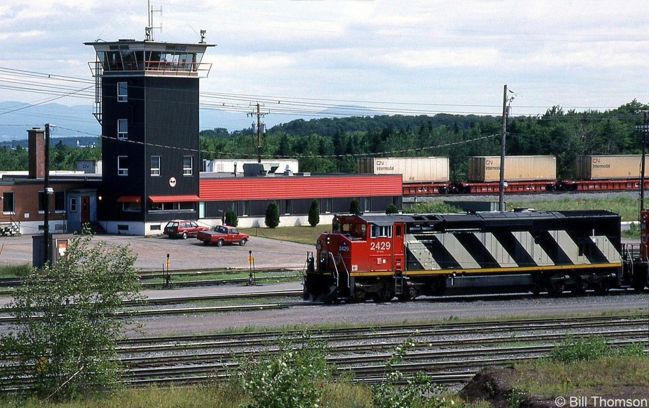 CN C40-8M 2429 is pictured passing by the yard tower at Joffre Yard on July 11th 1991. At the time cowl-bodied GE C40-8M's 2400-2429 were a little over a year old, making 2429 was the newest unit in the fleet (built March 1990). A second order for more GE's would follow in 1992.
