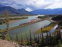 Running along the Athabasca River, CN 5785, with helpers CN 3825 and 2657, is in charge of Prince Rupert to Chicago intermodal train 192 at mile 220 on the CN's Edson Sub.