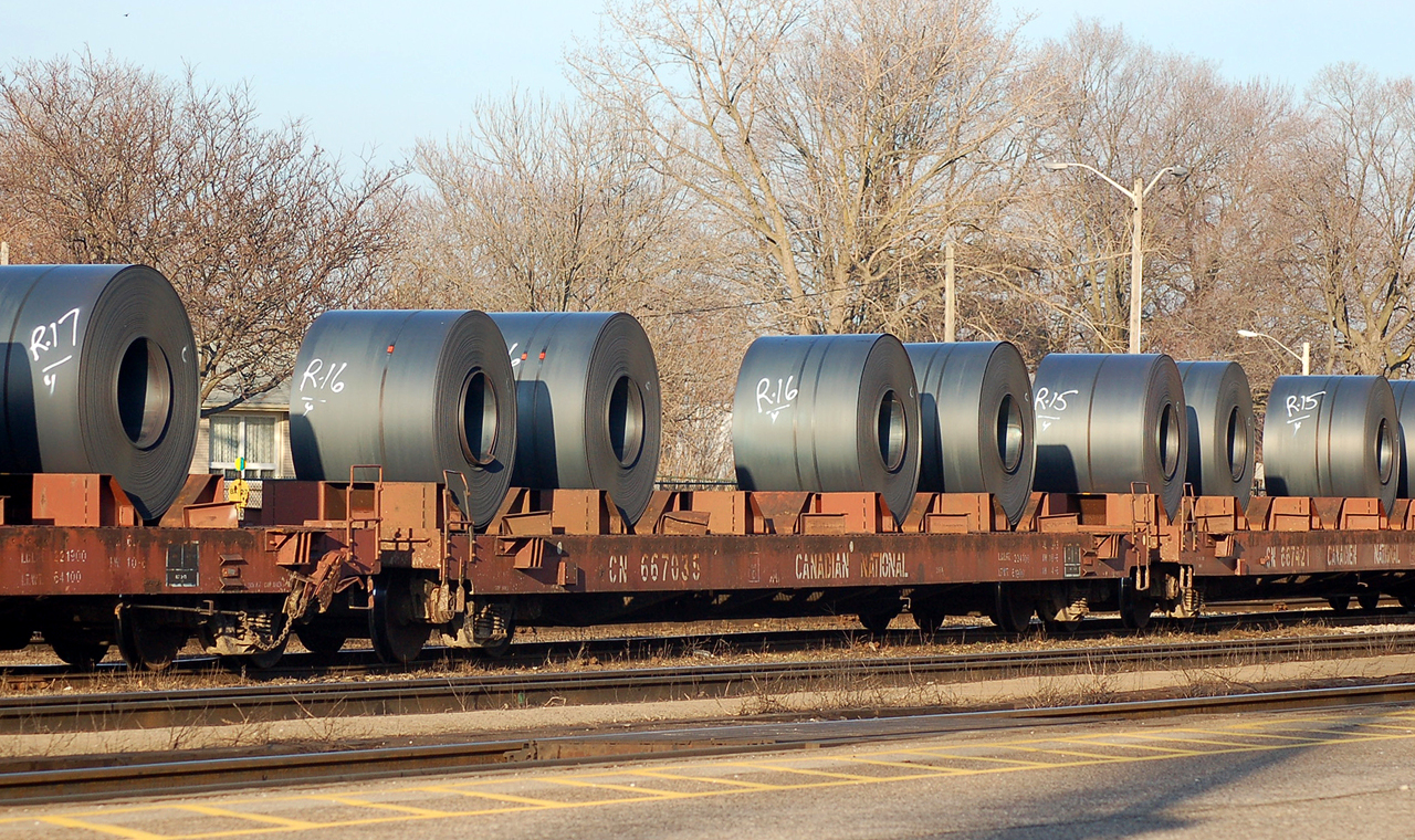 SOR 598 arrives at Brantford from Nanticoke to do their runaround move, and proceed back to Hamilton. CN 667035 is loaded with the standard 4 steel coils. Power was CN 7076 - CN 4121
