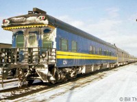 One of CN's business cars (possibly CN car 94) trails on VIA #64 at Kingston station in 1992. CN painted their business/official and track inspection cars in the same blue/yellow paint as VIA's ex-CN equipment, but with CN logos instead of VIA.