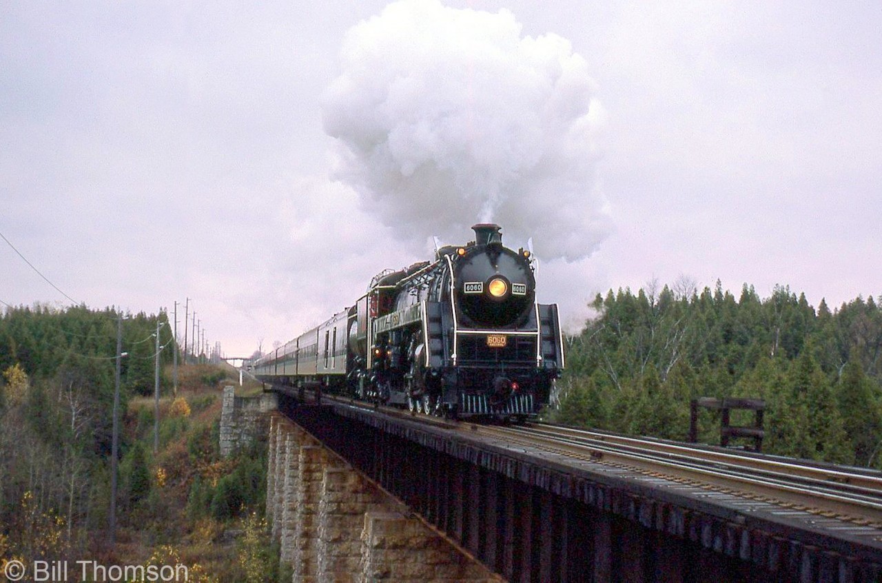 CN U1f "Bullet-Nosed Betty" 6060 handles an excursion train crossing the Eramosa River bridge, approaching Rockwood on the Guelph Sub on October 20th 1975.