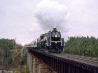 CN U1f "Bullet-Nosed Betty" 6060 handles an excursion train crossing the Eramosa River bridge, approaching Rockwood on the Guelph Sub on October 20th 1975.