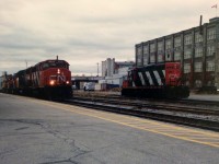 On November 4, 1998 my Dad and I stood on the station platform during a late fall afternoon and watched as CN 432 rolled into Kitchener from London with a consist typical of the time period. It included; GP40-2L(W)’s 9454, 9590 and GP9RM’s 4115 and 7020. We knew that in a couple of short weeks the CN trains on the line would become a part of history, as the Guelph Subdivision would be taken-over by the Goderich-Exeter Railway (GEXR) which was expanding and handling all the freight traffic on the line and the related spurs. This transition was just one part of an almost shortline revolution across Ontario as several shortlines would commence operations on lines sold or leased from CN and CP during the late 90’s. However, that was then. Now in 2018, just as CN took back the Hagersville Subdivision from the Southern Ontario Railway in September, CN is on the verge of regaining control of the Guelph Subdivision from GEXR on November 16. <br><br>  GEXR had originally begun leasing the Guelph Subdivision from CN for 20 years being operated under RailTex at the time. With the lease coming to an end and CN and current owners G&W not coming to an agreement to purchase or further extend the lease, CN had announced to the effected customers earlier in the year that they would be returning as the operators. GEXR will still operate the Goderich Subdivision between Stratford and Goderich as well as the Exeter Subdivision from Clinton to Exeter. <br><br> Reportedly, GEXR will retain only QGRY GP38-2 2008, GEXR GP38-3 2073 and RLHH GP38-2 2117 for use on their scaled down operations. As for new CN train assignments, as of November 7, the following has been confirmed by CN sources as the operating plan, which is still subject to last minute changes and adjustments.<br><br><b>  CN A431</b>, will be scheduled 7 days per week, Kitchener Turn, ordered 21:00 out of Mac Yard. <br><br>All assigned jobs will have the “L” designation and are as follows:<br><b>CN L540 (formerly 580),</b> ordered 0700 from Kitchener, 7 days per week- To service Guelph with Acton scheduled on Tuesday/Thursday- To service Kitchener and the Huron Park Spur-Including the interchange with CP at Kitchener<br><b> CN L568 (formerly 516)</b> ordered 09:30 from Kitchener, Monday-Friday, Stratford or St. Mary’s Turn operating St. Marys/Kelly’s/Thorndale-Tuesday/Thursday and Stratford other days<br><b>CN L566 (formerly 584)</b> ordered 21:00 from Kitchener, Monday-Friday to service Waterloo Spur and Elmira<br><b>CN L542 (formerly 582)</b> ordered 07:30 from Guelph, Monday-Friday to service Guelph/Fergus Spur/Cambridge. <br><br>During September, CN began constructing a new operations centre in the Kitchener yard, which will be where the crews are based. As of early November the new building was seemingly complete having been assembled with modular sections and was 3600 square feet in length complete with newly constructed wooden ramps. It is situated near the old wye in the yard and according to sources; CN will base the power for the local assignments by this new building. CN will now interchange traffic with GEXR at Stratford as previously done 20 years ago with GEXR motive power still laying over in Stratford yard between assignments as CN will still retain ownership of the yard. The transition from GEXR to CN will no doubt be well documented so please stay tuned as all the latest sightings will be photographed as two decades later CN makes their return to the Guelph Subdivision. 