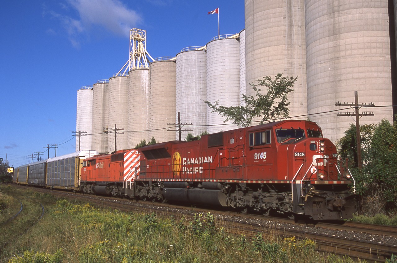 With a consist unlikely to ever be seen again on CP,  SD9043MAC 9145 and SD40-2F 9002 lead train 138 past the Kraft mill in Streetsville Ontario.