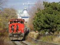 With the dome of Bonsecours Market in the background, the Pointe St-Charles Switcher is leaving the Port of Montreal with 17 cars received in interchange from the port. 