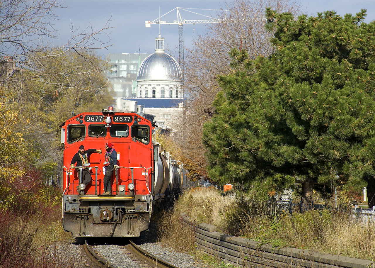 With the dome of Bonsecours Market in the background, the Pointe St-Charles Switcher is leaving the Port of Montreal with 17 cars received in interchange from the port.
