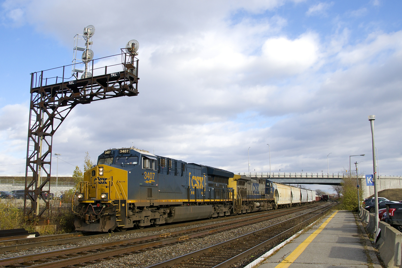 CSXT 3407 & CSXT 77 lead CN 327 through Dorval on an intermittently sunny and very windy afternoon.