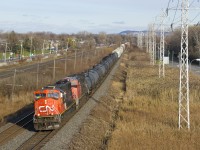  CN 5783 & CN 2179 lead a 130-car CN 377 which is approaching MP 14 of the Kingston Sub, as the conductor waves from the lead unit.