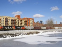 After being closed since this past spring due to extensive work on the Lachine Canal's retaining walls, the East Side Canal Bank Spur reopened last week. Here CN 4115 & CN 9677 shove 8 grain cars to Ardent Mill, the only client on this line.