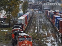 CN 2312 trundles through a swampy Glen Yard as its intermodal transfer snakes its way through East Vancouver