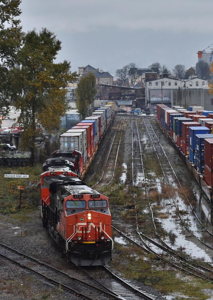 CN 2312 trundles through a swampy Glen Yard as its intermodal transfer snakes its way through East Vancouver